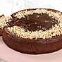 Chokladcheesecake med kola och nötter