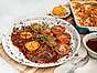 Entrecôte med rödvinssås, bakade tomater och potatisgratäng