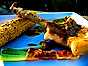 Grillade fläskkotletter med serranolindad vårlök, curranchosmör och majskolvar