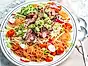 Koreansk het glasnudelsallad med fläskkarré