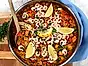 Paella med kyckling och räkor på havreris