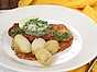 Panerad fläskschnitzel med sardell- och citronsmör